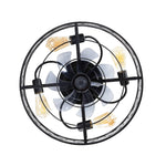 Direct underside view of a bladeless caged ceiling fan showcasing a central 7-blade translucent acrylic turbine surrounded by 4 symmetrically placed E26 sockets with amber bulbs
