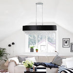 Large anti-glare crystal chandelier hanging in a modern grand dining room