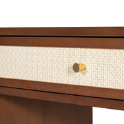 Detailed view of the authentic hand-woven natural rattan drawer front with minimalist metal handles on a Vietnam-crafted dressing table.