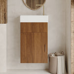 Slim wall mount bathroom sink cabinet with a rose gold handle installed in a small powder room layout.