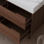 Interior view of four open soft close storage drawers with hidden gold recessed handles and adjustable 80cm plumbing flexible drain pipe.